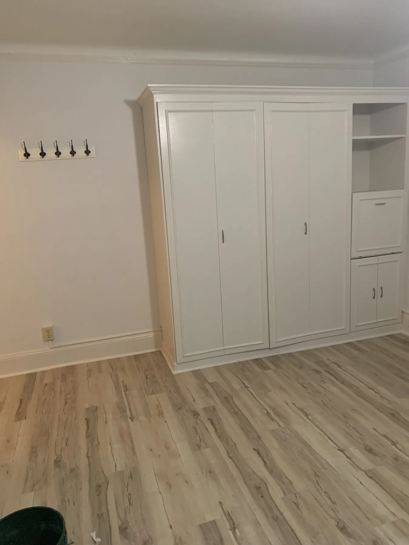 Custom closet with built-in shelving and new flooring