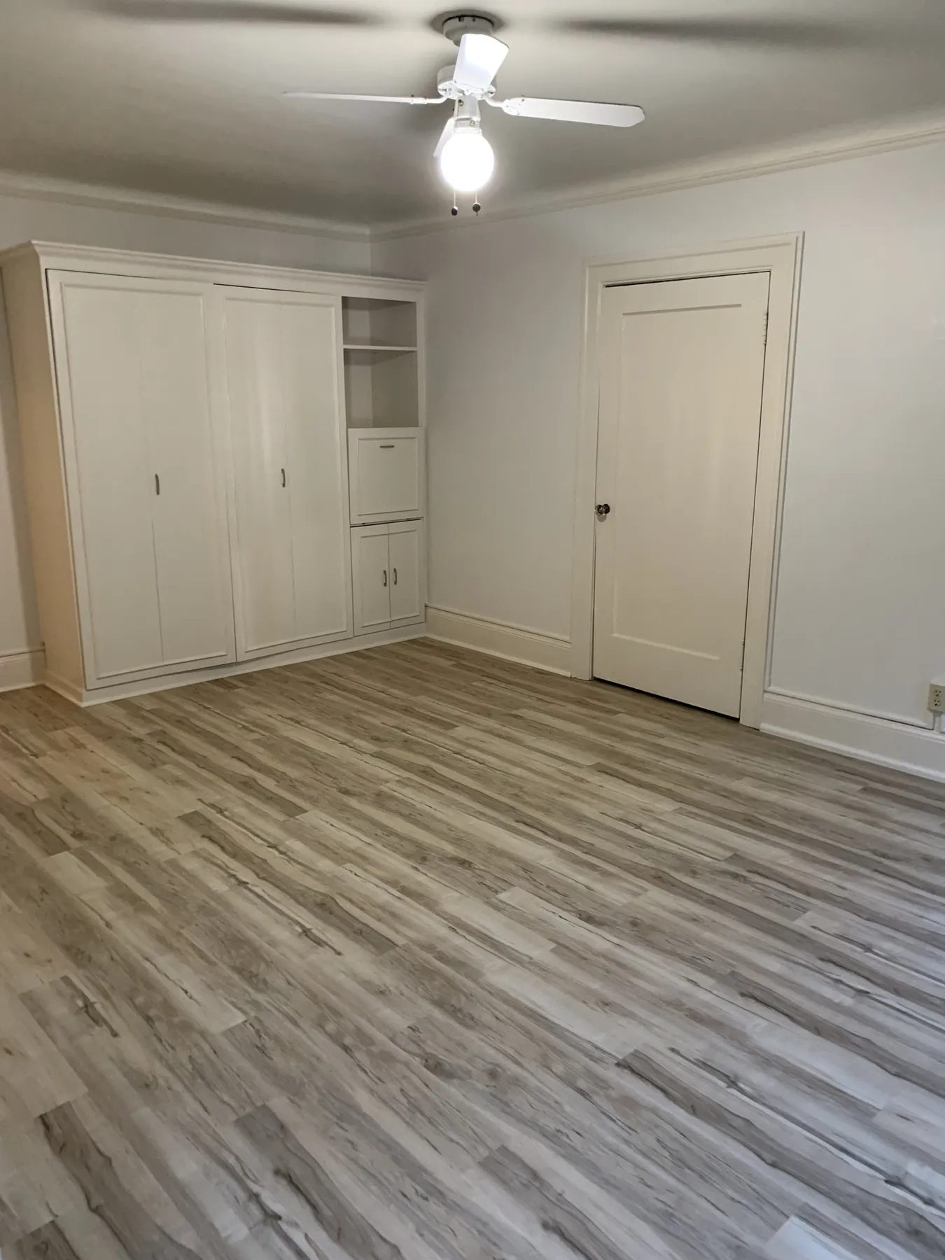 New living room with fresh flooring and trim