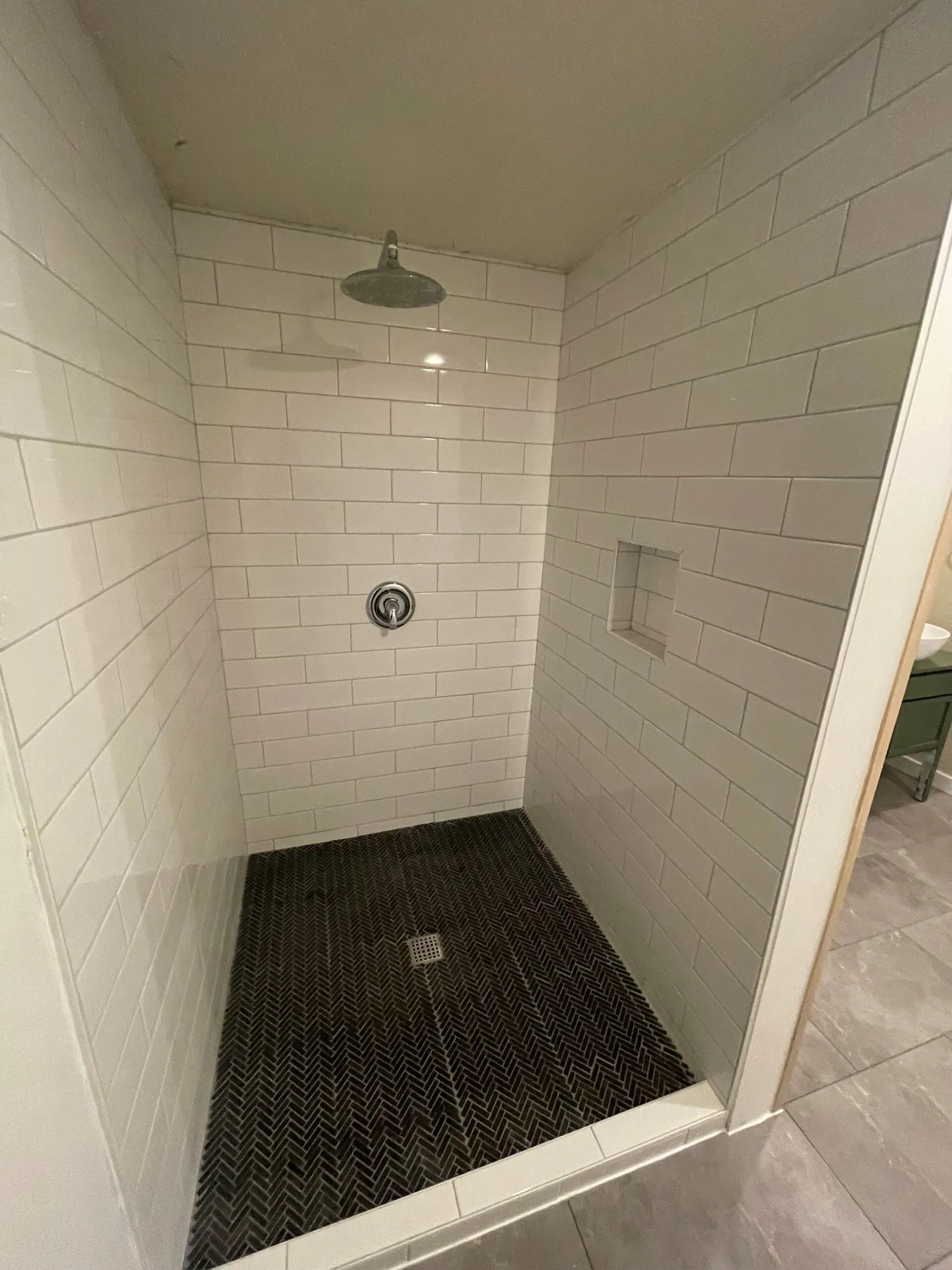 Newly installed shower with tile and glass