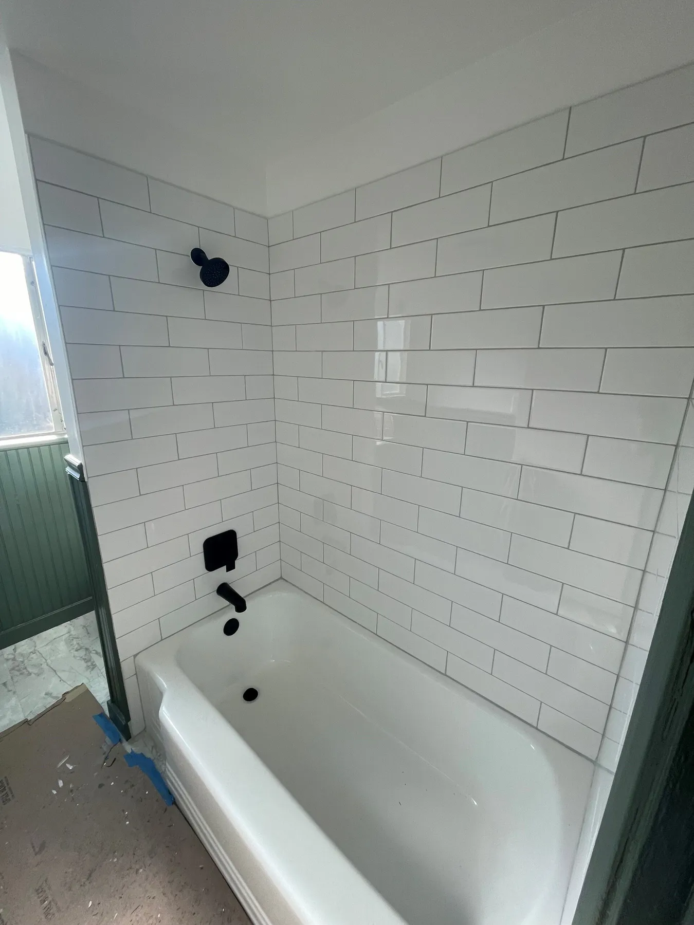New tub surround with shower tile